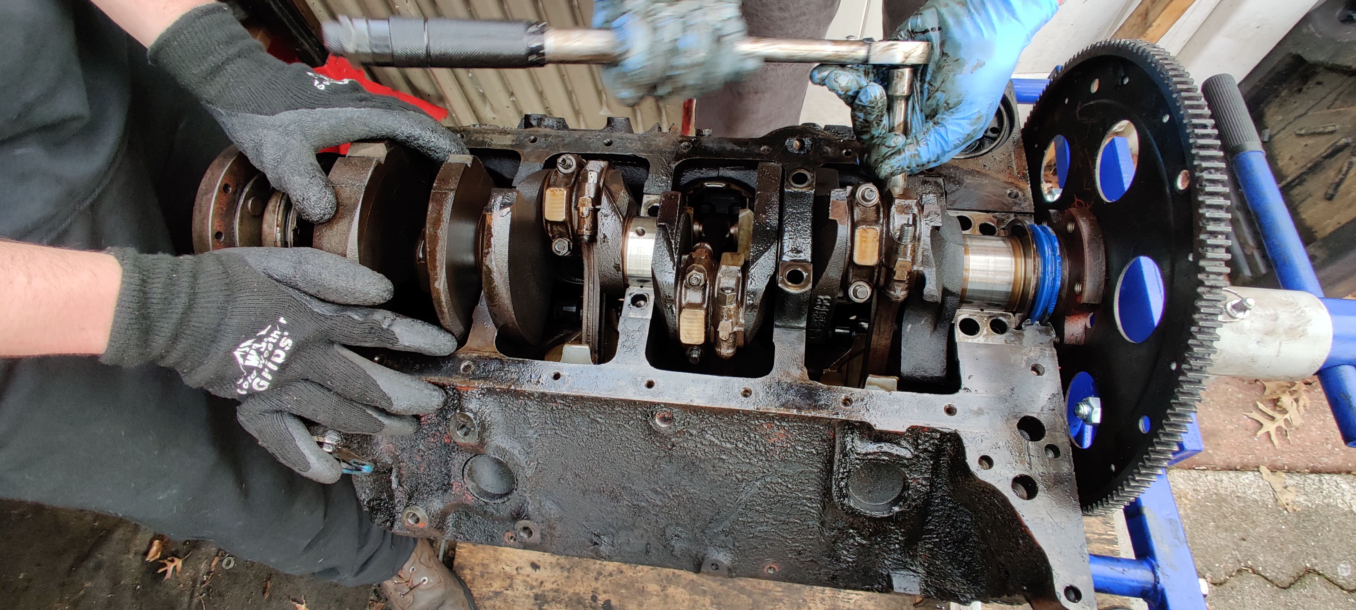 Brandon and Nick use a torque wrench to get the connector rod bolts off